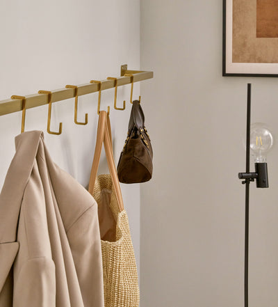 Kleren ÜBERECK Muur